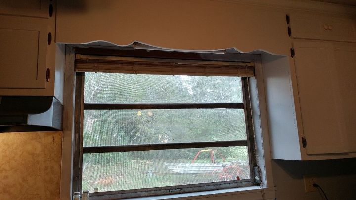 q how can i jazz up my otherwise bland window that has a wooden cornice