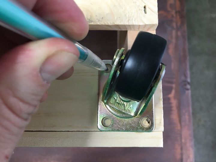 s step by step turn crates into the perfect pieces for your home, Step 2 Attach caster to one corner of crate