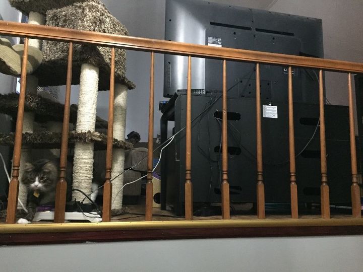 q covering wire behind a banister