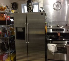 refrigerator next to stove in kitchen