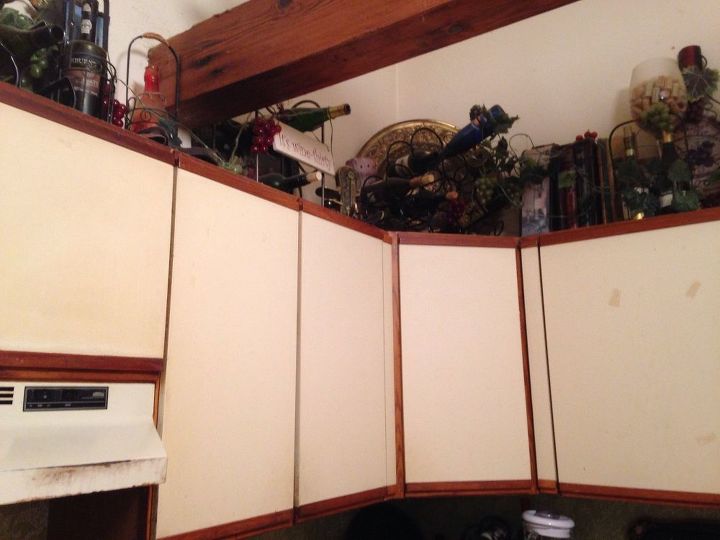 q what can i do to make my awful melamine cabinets look less awful