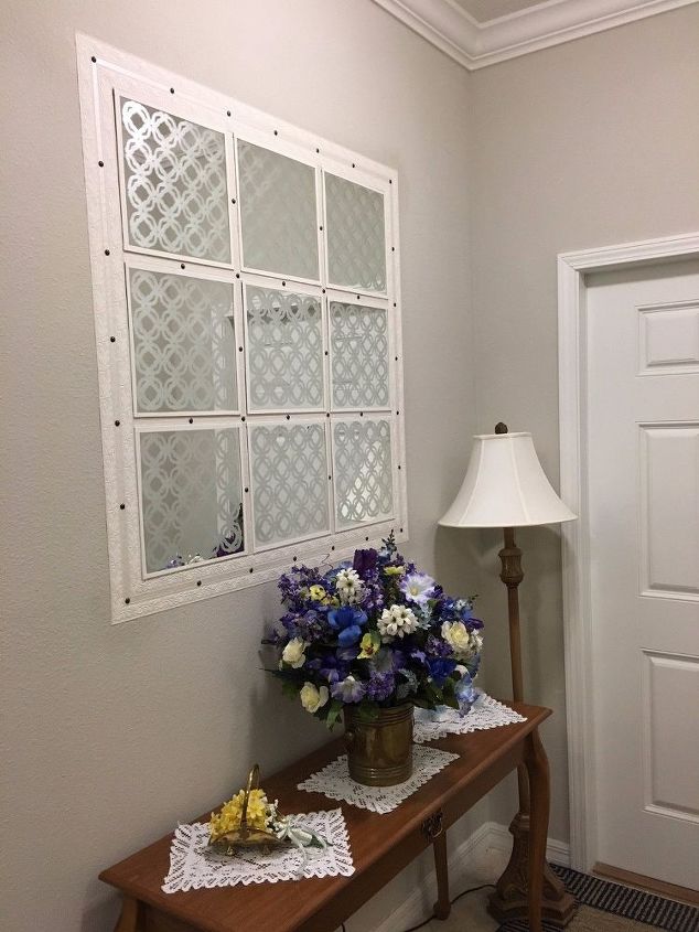 faux window deceptively makes the foyer bigger