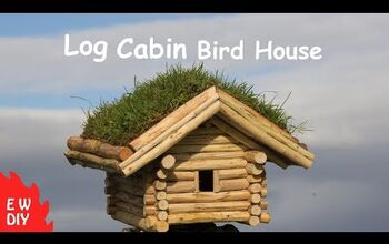 Casa de pájaros de la cabaña de troncos