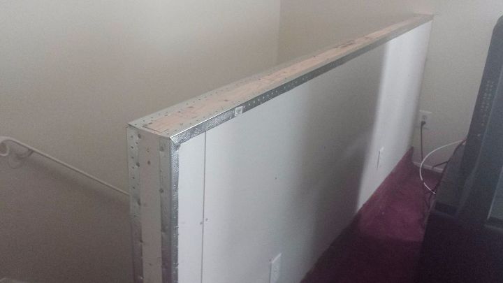 how to build a half wall at top of staircase, metal corners on half wall next to stairs and red carpet