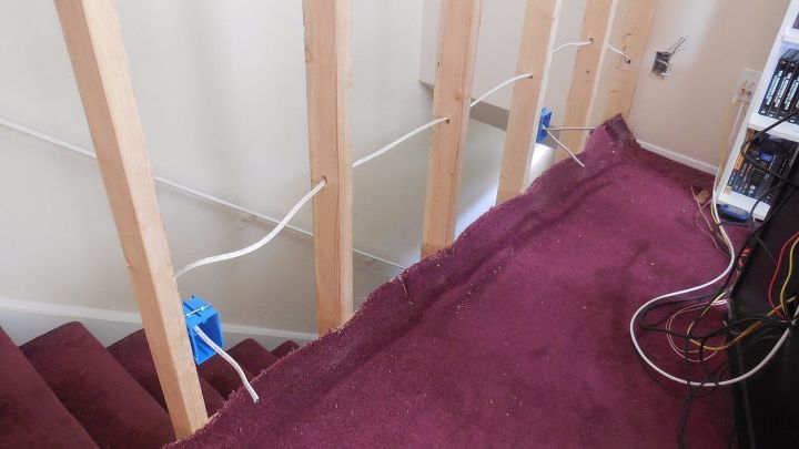 how to build a half wall at top of staircase, electric cord thread through wood framing
