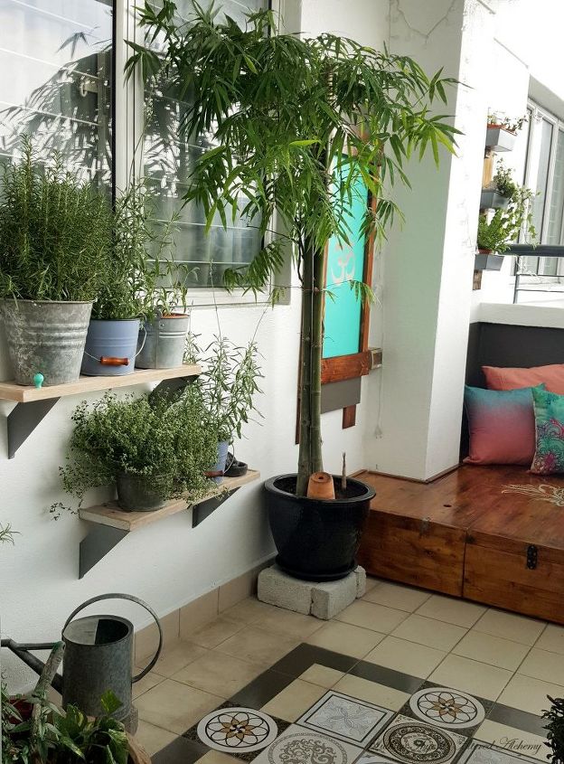my bohemian balcony makeover built a mini deck stained stenciled, My bamboo plant and herb shelves