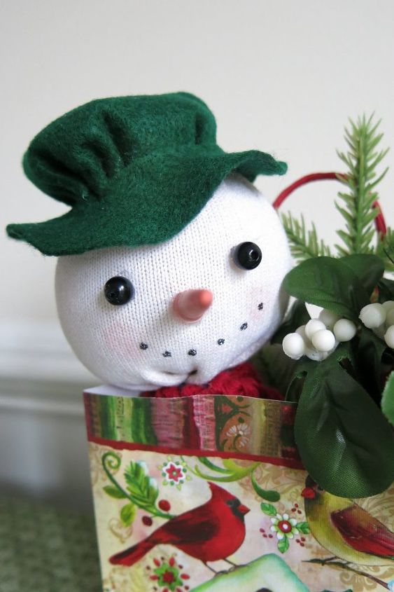 take a peek at this sock snowman peeking out of a holiday gift bag
