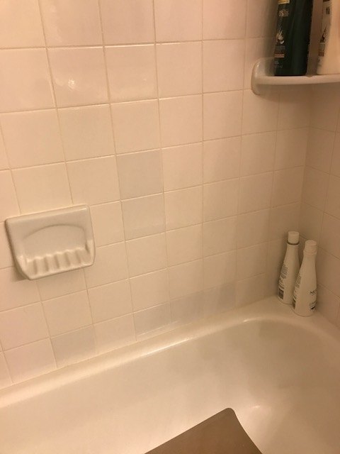q a few of our bath tub tiles have become slightly discolored