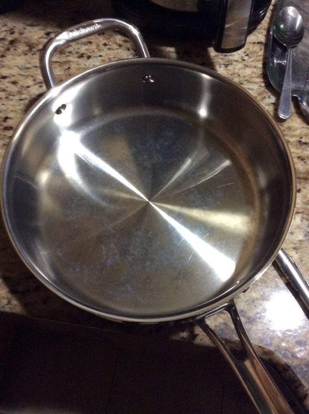 q how do i remove white spots from stainless steel pots and pans