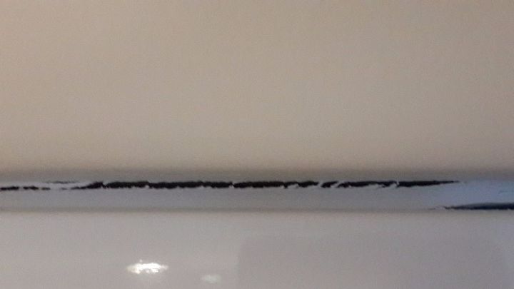 cracking sealant above kitchen cupboard