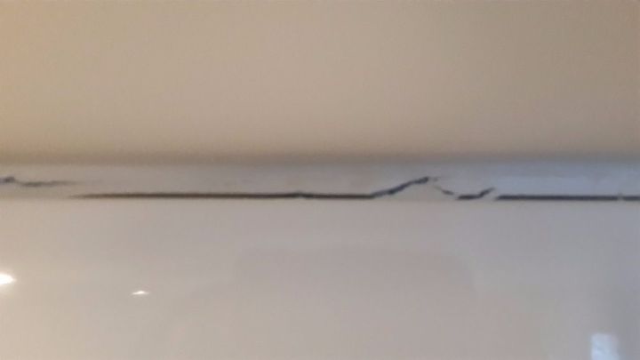 cracking sealant above kitchen cupboard