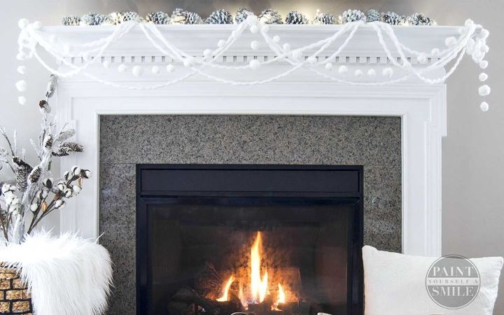 s make your home a winter wonderland with these stunning ideas, Elegant Winter Fireplace Garland