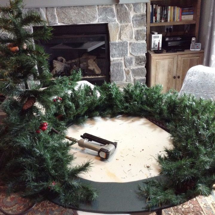 a giant christmas wreath, Stapling the tree limbs to the plywood