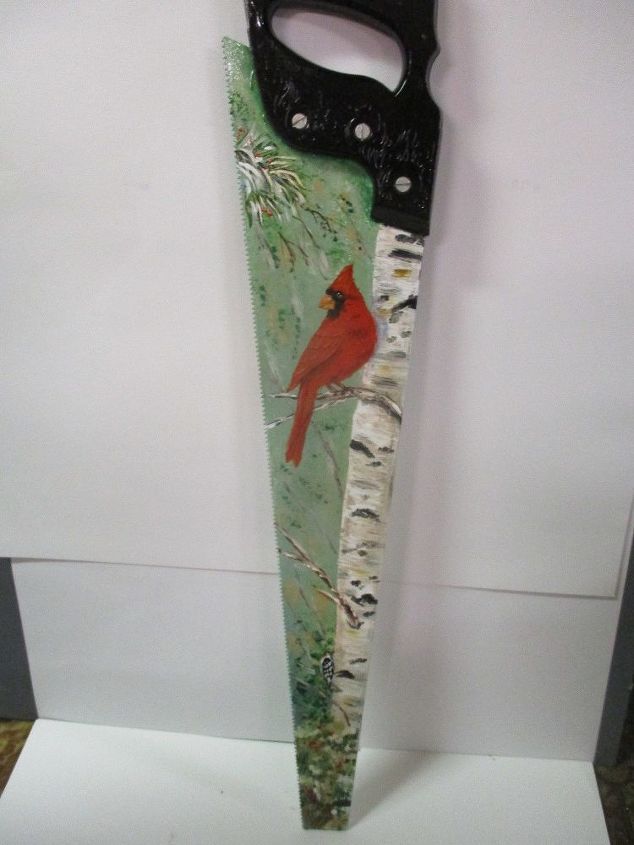 painted vintage cross cut hand saw with winter scenes