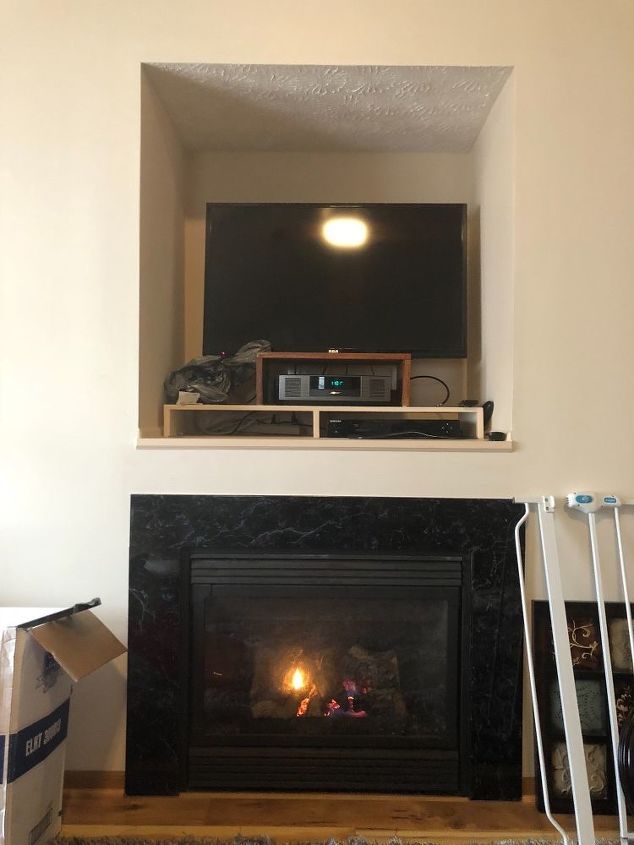 tv cut out over fireplace need some ideas