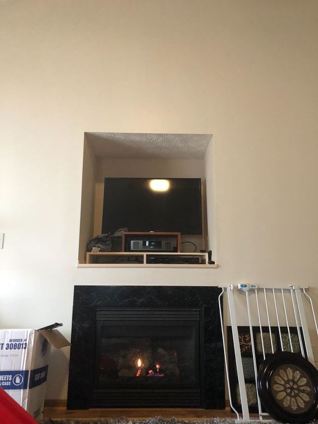 q tv cut out over fireplace