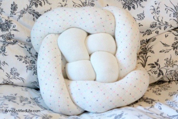 s 15 cute pillows you can make for your sister, Create A Super Cool Knotted Pillow