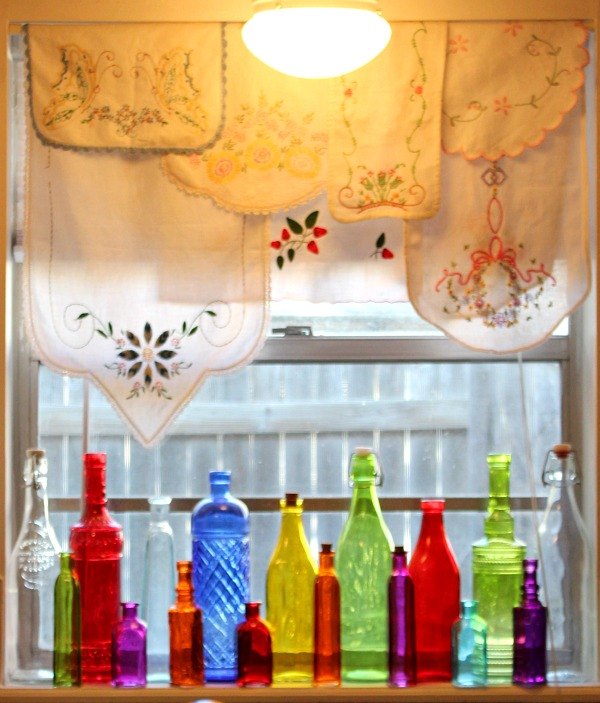 31 ways to get privacy inside and outside your home, Line colorful bottles along the windowsill