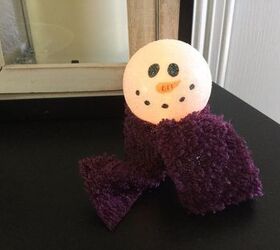 s 30 different ways to diy an adorable snowman this winter, Place a ping pong ball on an LED light