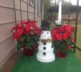 s 30 different ways to diy an adorable snowman this winter, Pile terra cotta pots and add a smile