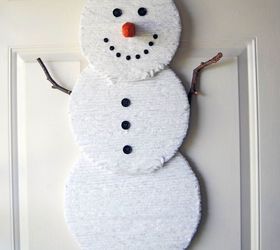 s 30 different ways to diy an adorable snowman this winter, Wrap circles in yarn and hang it on your door