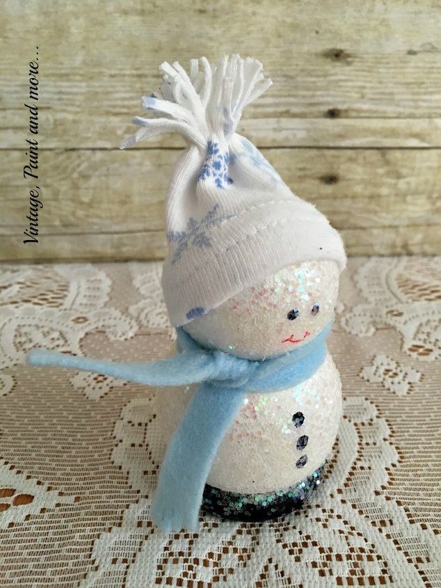s 30 different ways to diy an adorable snowman this winter, Cover wooden balls in glitter