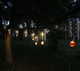 15 unexpected ways use christmas lights in your home, Craft tin can lanterns for your outdoors