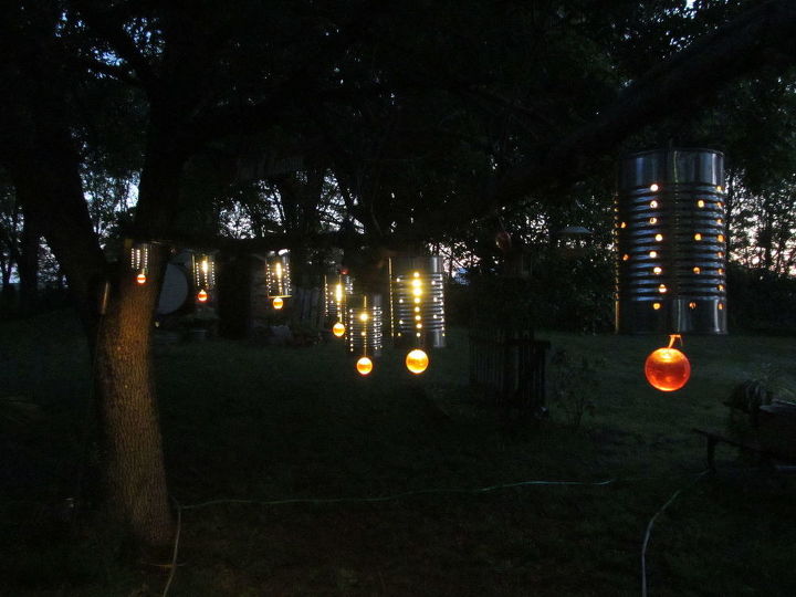 15 unexpected ways use christmas lights in your home, Craft tin can lanterns for your outdoors