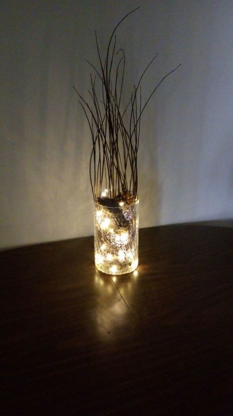 15 unexpected ways use christmas lights in your home, Light up a pinecone centerpiece