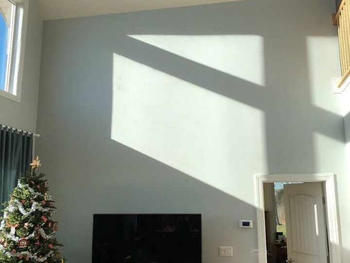 q how to decorate a large living room wall