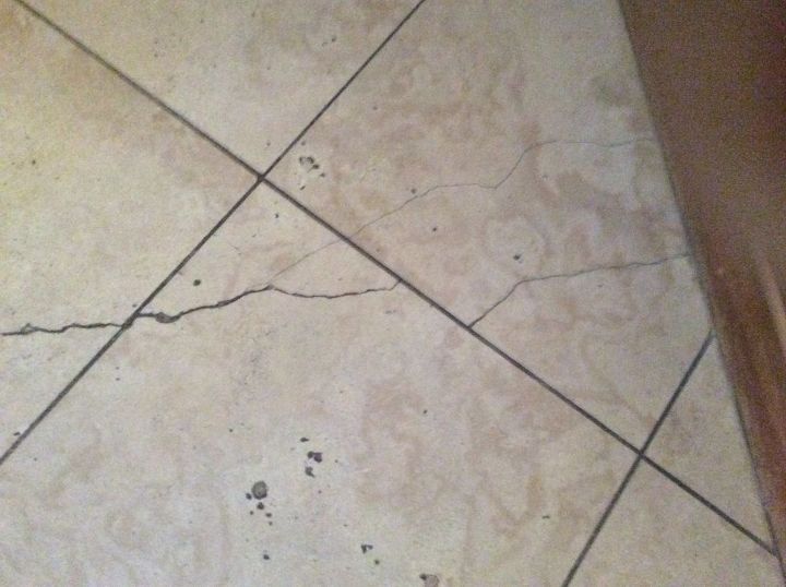 q my travertine kitchen floor has severe cracks any suggestions
