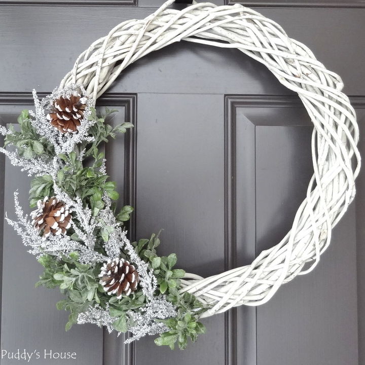 s 20 wintery wreath ideas that you ll want to make for your home, Farmhouse Pinecone Wreath