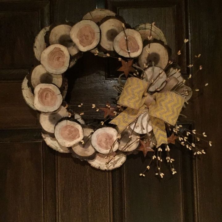 s 20 wintery wreath ideas that you ll want to make for your home, Rustic Wood Slice Wreath