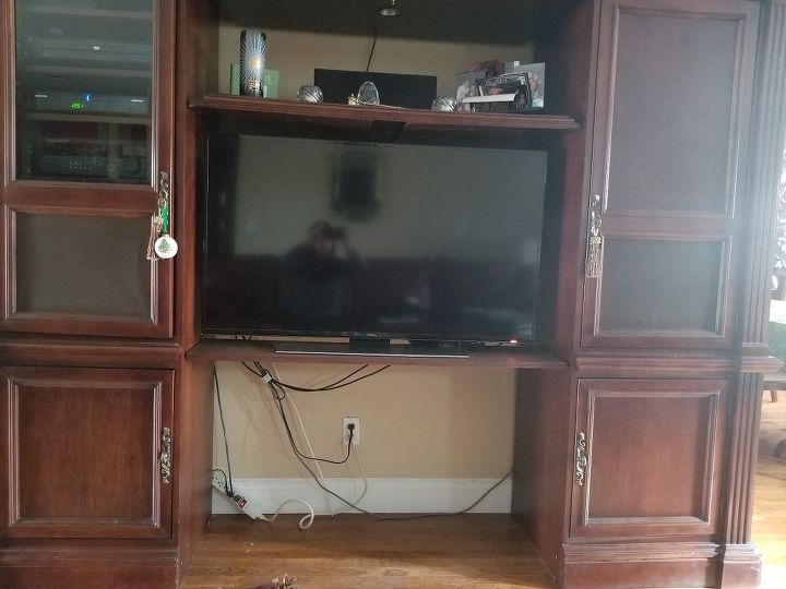 q what can i put in empty space under tv there was a bigger tv there bef