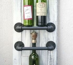 the best industrial style diy ideas for your home using pipes, An Easy Chic Wine Rack