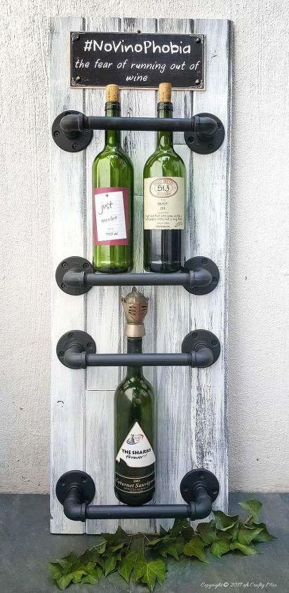 the best industrial style diy ideas for your home using pipes, An Easy Chic Wine Rack
