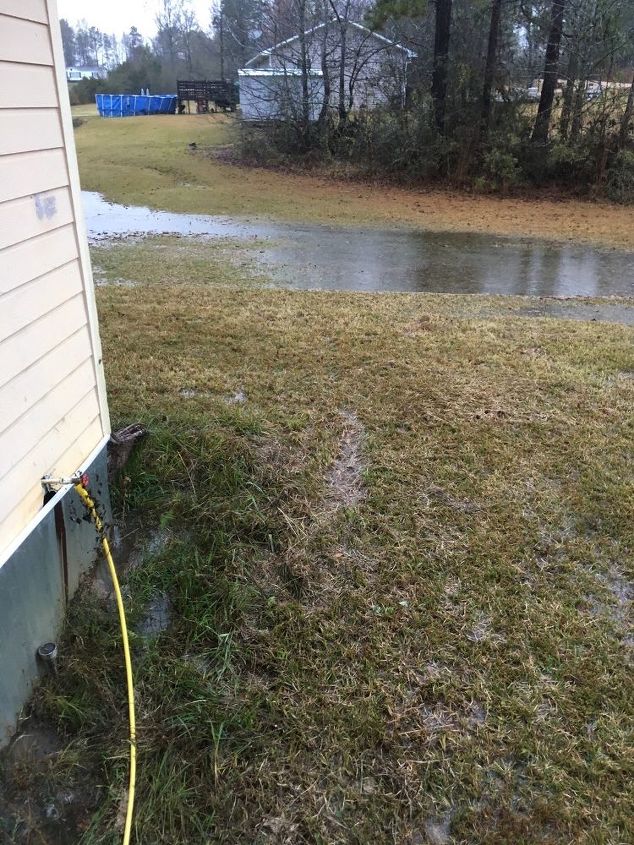 q how can i stop this water from coming onto my property