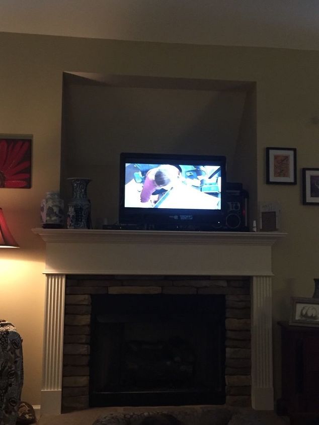 how can i decorate a huge recessed tv opening over my mantle