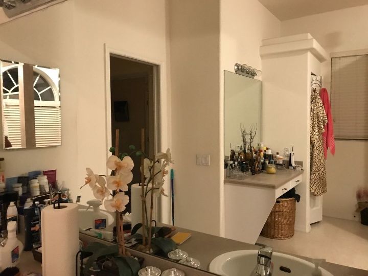 q taking down a large bathroom mirror