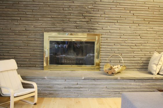 q what can you suggest to update this stone fireplace