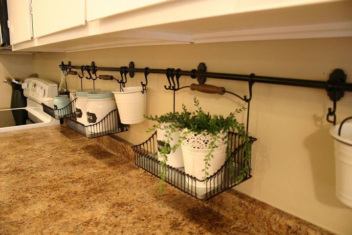 keep your clutter off the countertops with these clever ideas, Store items in hanging baskets