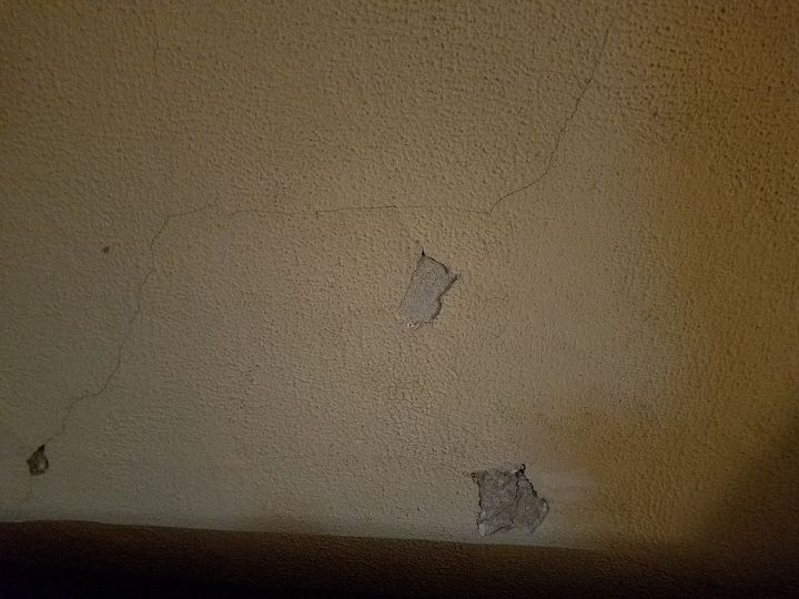 q how do i fix cracks and holes in my very old house it has wood slats