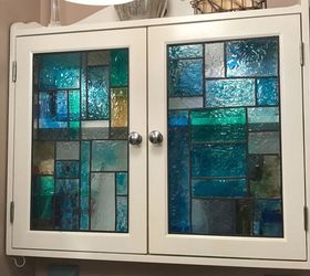 faux stained glass shower door and medicine cabinet
