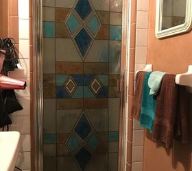 faux stained glass shower door and medicine cabinet