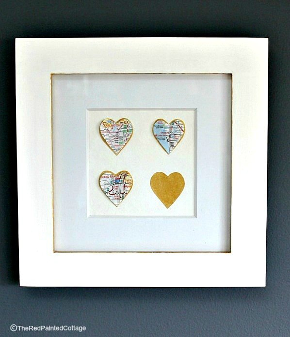 s 25 creative ways you can decorate using maps, Frame Hearts Covered In A Map