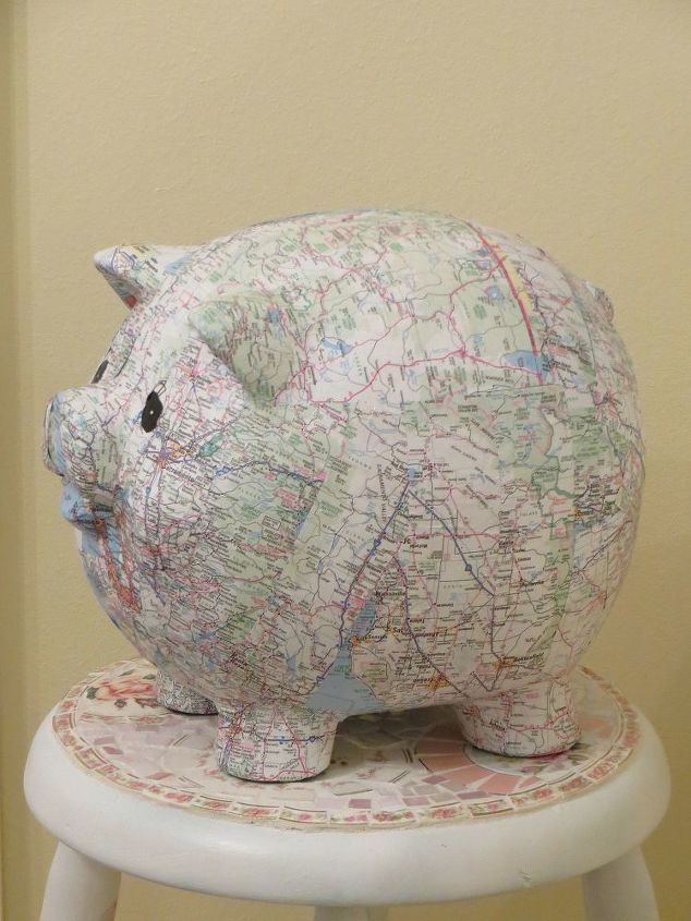 s 25 creative ways you can decorate using maps, Piggy Bank Covered In Maps