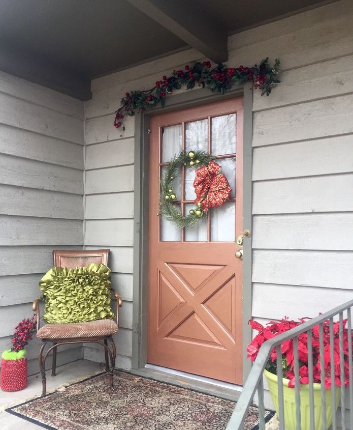 fall front porch copper door, The poinsettias light up at night
