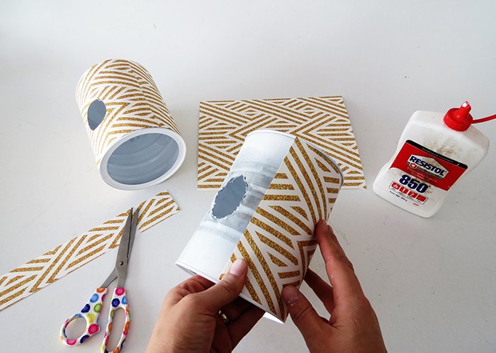 turn a tin can into a stylish wall lamp