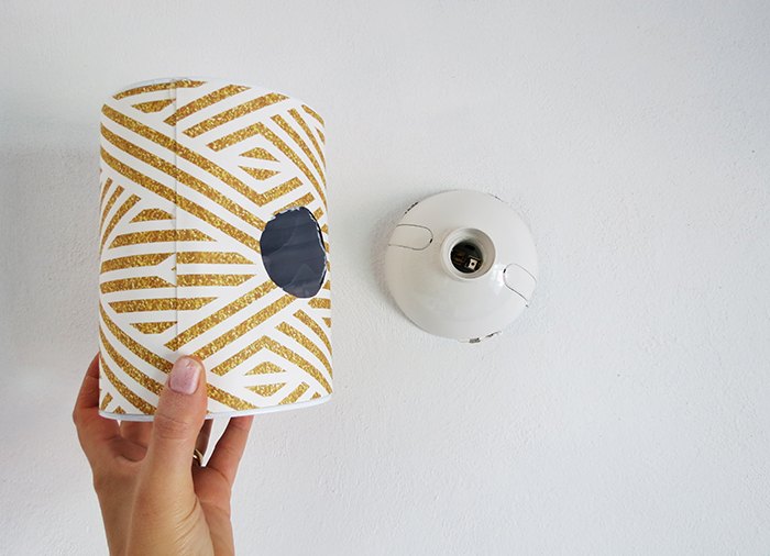 turn a tin can into a stylish wall lamp