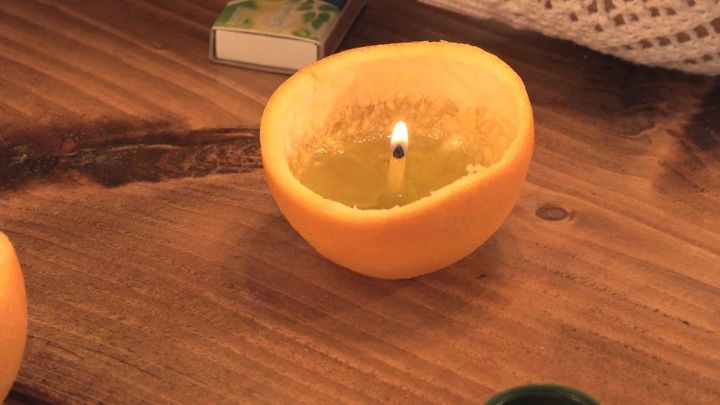 16 formas divertidas de usar la comida para decorar tu casa, Vela de c scara de naranja DIY